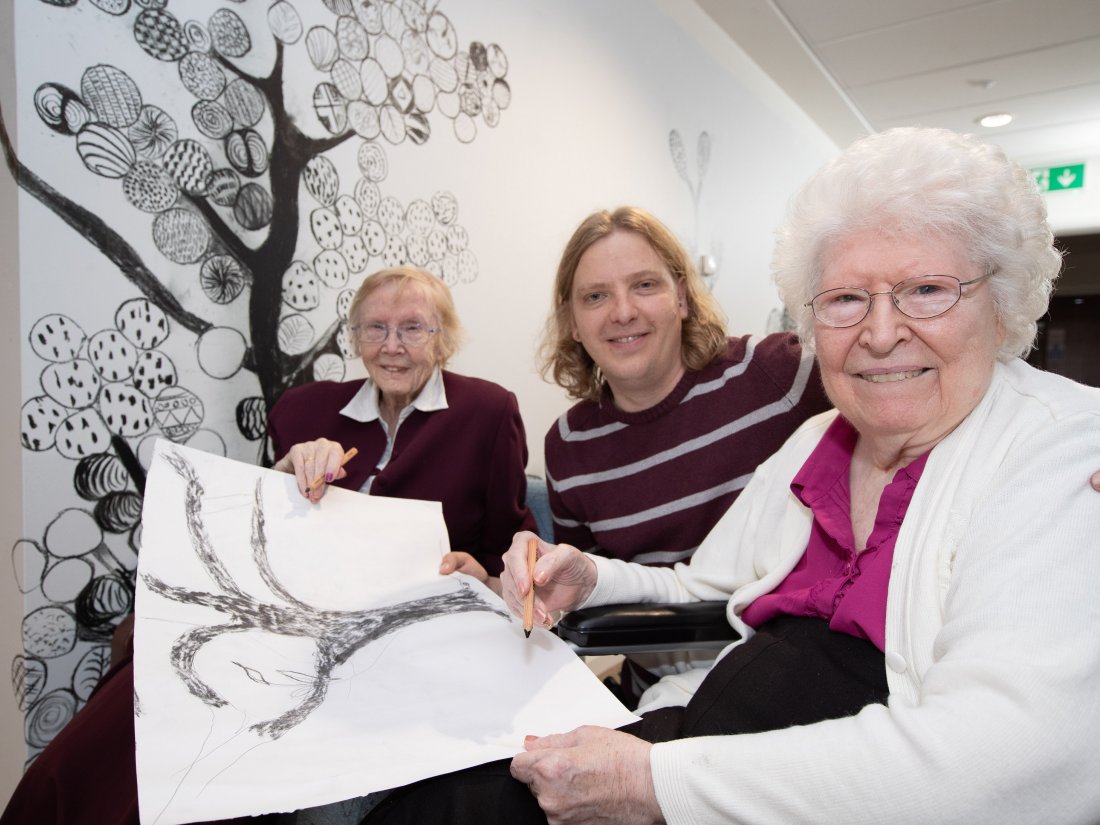 Pictured (L-R): Resident Evelyn Ball, Experience Coordinator Daniel Turner, and Resident, Eileen Walford.